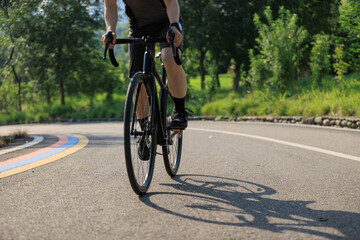 Fototapeta premium People cycling on the greenway