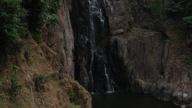 Low flow volume from the Haew Narok waterfall in the dry season. Rain forest at Khao Yai National Park in Thailand.