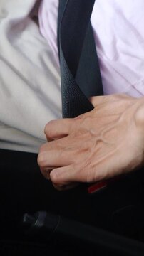 The process of clipping the seat belt in the car close up