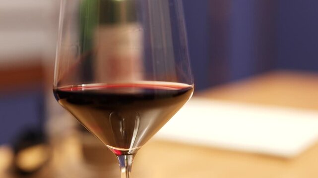 Close Up of Red Wine Swirling in a Crystal Glass