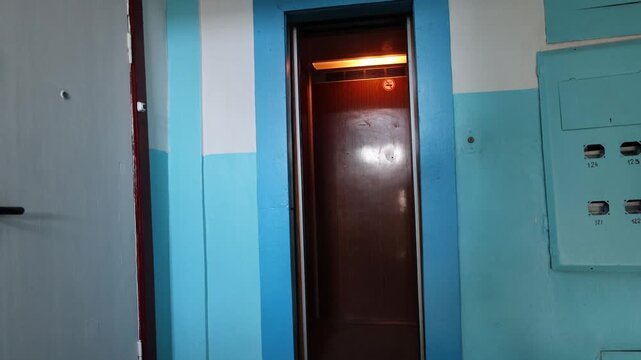 Elevator blue walls. Elevator view staircase.entrance hall inside an old nine-story building High quality 4k footage