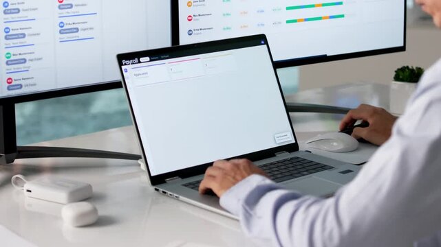 Human Resource Manager Uses Payroll Software