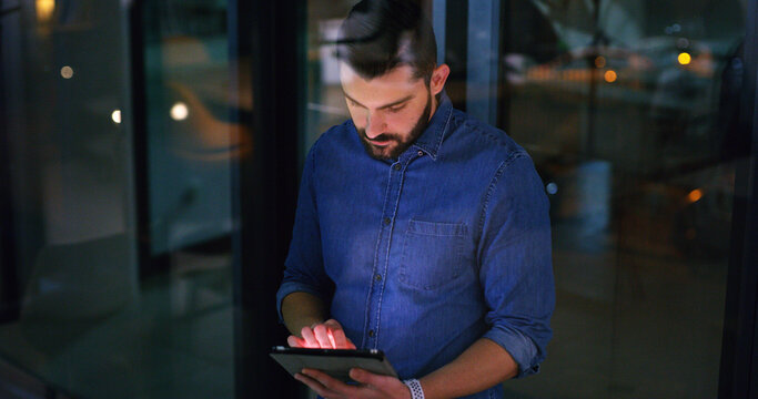Tablet, night and business man in office for compliance email, research or development project. Tech, reading and person in workplace on deadline, review policy or regulation report by window