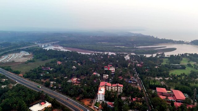 Wide cinematic aerial of Talpona River highlighting broad river channels, mangrove-covered islands, and textured sandbars blending into an expansive tropical horizon.