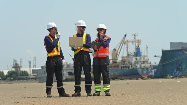 Construction team discussing project progress dockyard group photo urban setting eye-level view collaboration for efficiency