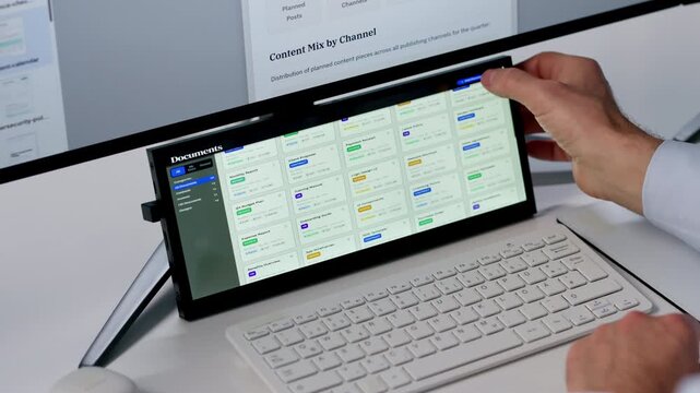 Man Using Touchscreen Monitors