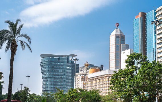 MACAU CHINA - DECEMBER 27 2025: Macau city skyline with Bank of China tower and modern hotel buildings sunny day urban architecture travel tourism landmark