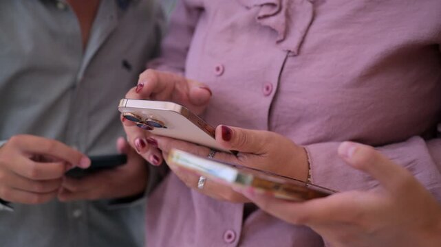 vibrant lifestyle photo of a modern family interacting with an artificial intelligence assistant on smartphone.