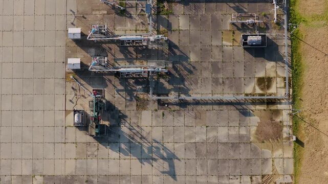 Aerial view of UGS Damborice industrial facility with complex piping and machinery on concrete pads in Damborice, South Moravian Region, Czechia.