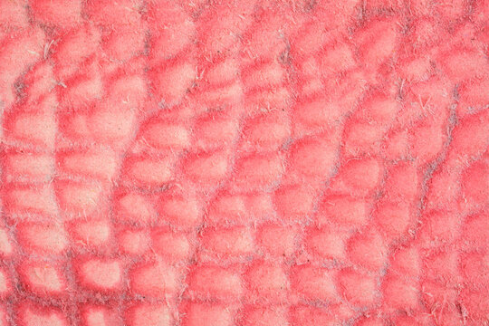Close up of red textured fabric surface