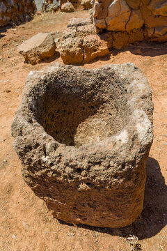 Ancient stone vessel or basin at the Malia Minoan Palace ruins on Crete, Greece