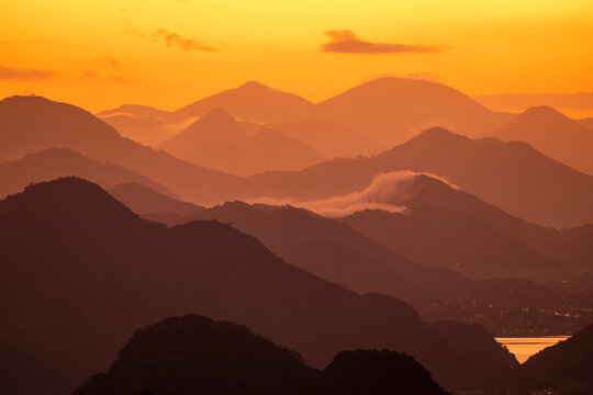 Beautiful view to layers of mountains during sunrise