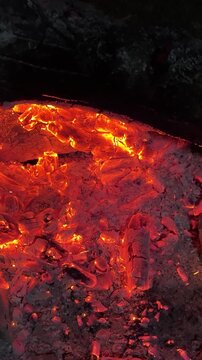 Macro Detail of Burning Wood Coals and Glowing Ash
