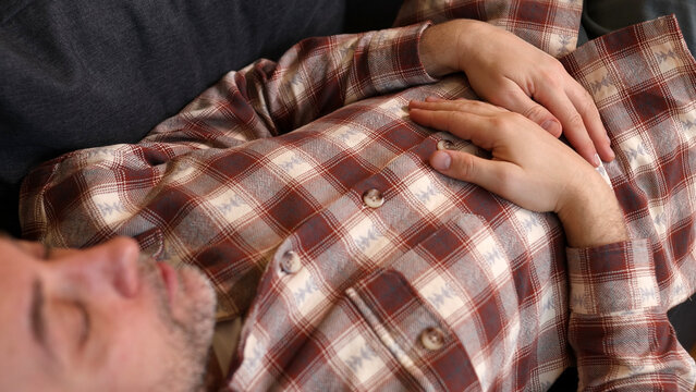 Man with gastritis, chest, stomach and abdominal pain at home.