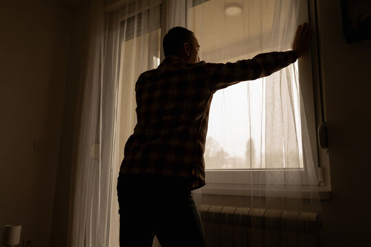 Man with headache, depression, sadness and loneliness at home