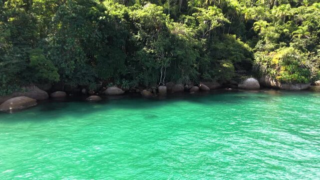 Clear Turquoise Water Near a Rocky Tropical Shore