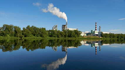 An industrial factory on the riverbank. environmental pollution © Pokoman