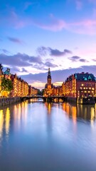 Fototapeta premium Canal with buildings and church tower.