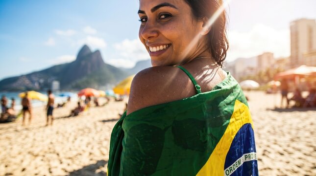 Woman with Brazilian flag on Ipanema Beach, Rio de Janeiro