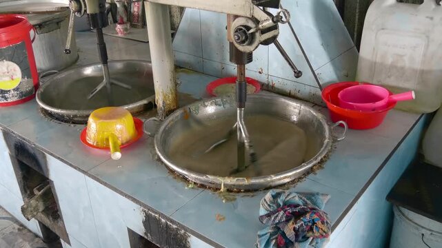 Large specialized mixer used for making traditional Vietnamese sweets, such as coconut candy in the Mekong Delta region of Vietnam
