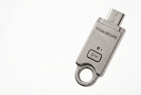 Titanium security passkey dongle isolated on white