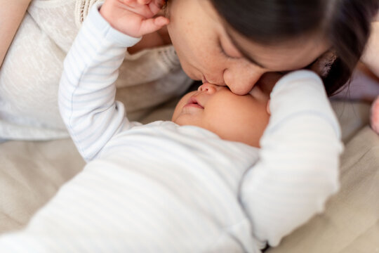 Tender moment between mother and baby.