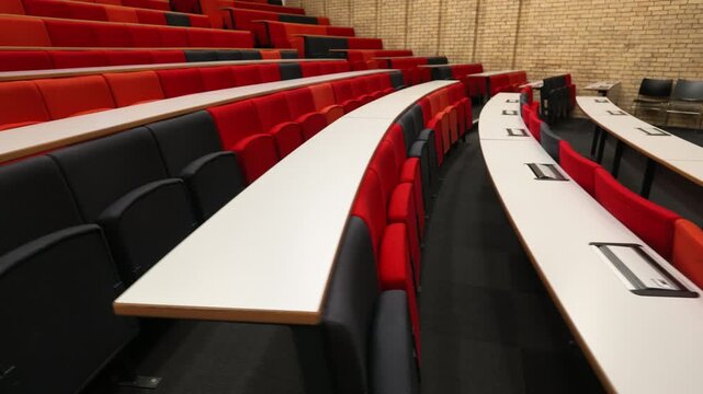 Empty College university lecture hall with red seats