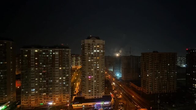 Moscow, Russia, 10.05.2025, Dramatic night cityscape with powerful lightning storm illuminating the urban skyline. Electric bolts strike through dark stormy clouds above glowing city lights, creating 