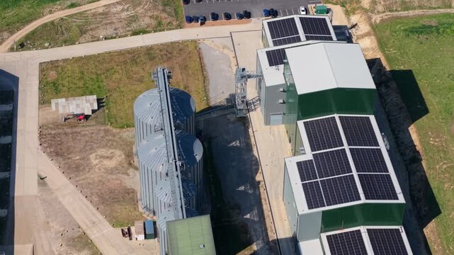 Aerial view of Navara Oat Milling featuring large grain silos and solar panels on the facility roof in Kettering, England, United Kingdom.