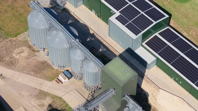 Aerial view of Navara Oat Milling facility featuring large grain silos and solar panels on rooftops Kettering, England, United Kingdom.