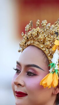 Close Up of Thai Khon Dancer in Traditional Golden Headdress