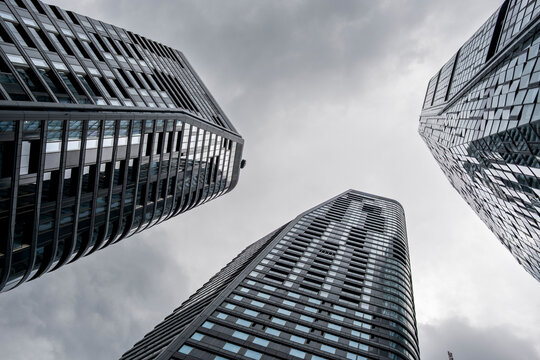 Glass towers pull the eye upward in Frankfurt, where skyscrapers, facade lines and architecture shape a tight district perspective under sky