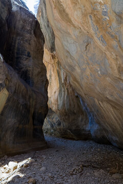 Towering rock walls in the narrow Sarakina Gorge on Crete island, Greece