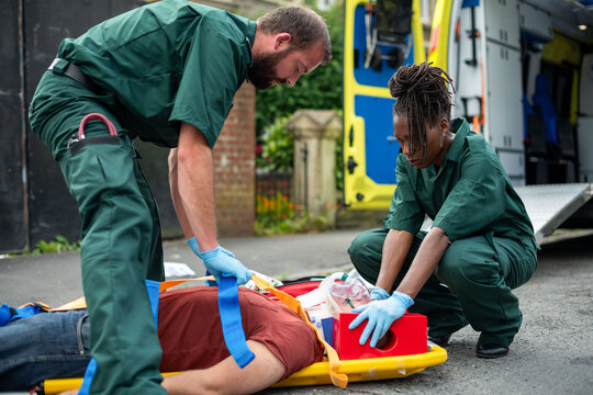 Emergency medical team assisting patient