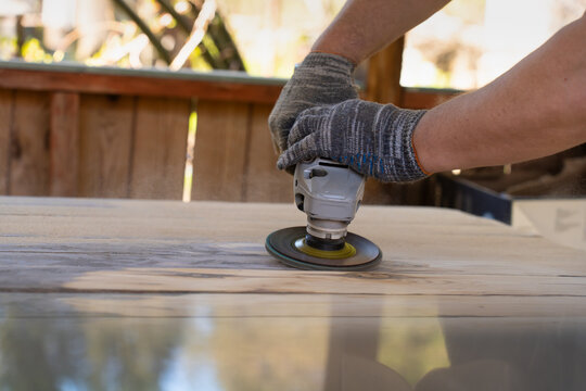Furniture Maintenance Task With Professional Tool Being Used By Handyman In Gazebo