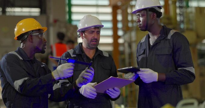 Factory technician inspecting auto parts, metal rod at machining station