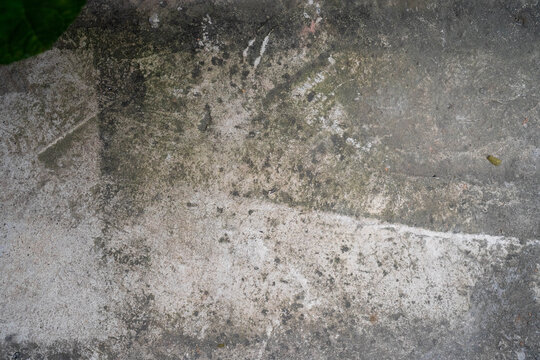 Textured concrete surface with natural wear and subtle color variations.