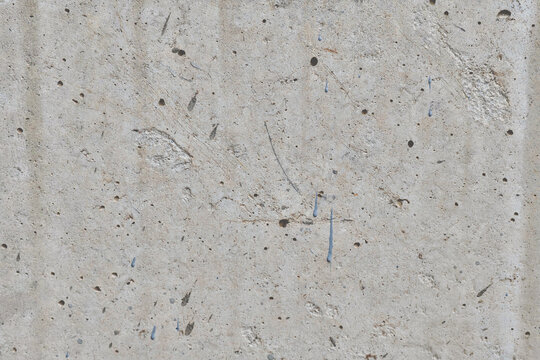 Close-up of a textured concrete surface with varied colors and patterns.