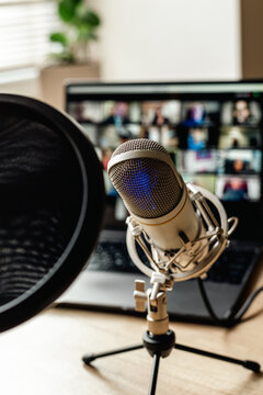 On the air concept - microphone with filter and laptop computer. Podcast recording