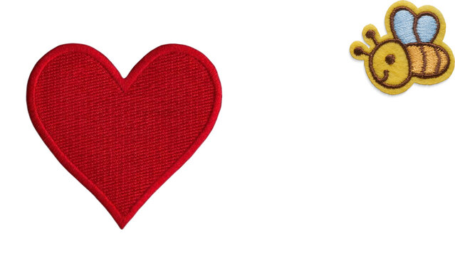 Red heart and cute bee embroidery patches isolated on a white background.