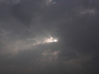 Fototapeta premium god rays on a dark clouds