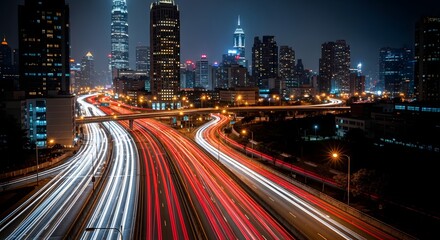 Fototapeta premium Dynamic urban nightscape with a blur of vibrant light trails from busy highway traffic, showcasing the energetic flow of modern city life amidst illuminated architectural skyscrapers