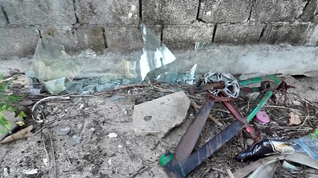 A video shows a pile of trash and debris on the ground