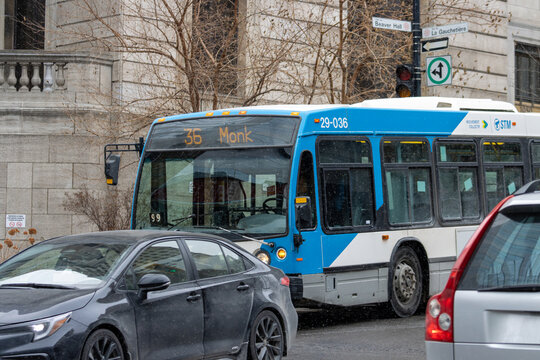 MONTREAL, CANADA, 22 December 2025 : City Bus in Urban Winter Traffic Scene