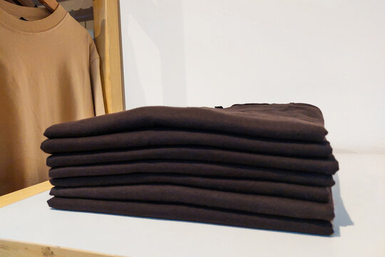 Black t-shirt folded in the wardrobe