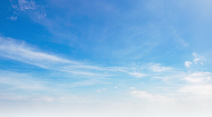 Soft wisps drift through vast blue skies © lovelyday12