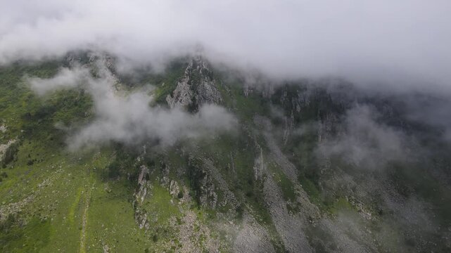 Foggy, cloudy, smoky mountains formed by steep cliffs. Peaks that are hard to reach.