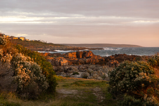 sunset light over DeKelders coastline, Gansbaai, South Africa