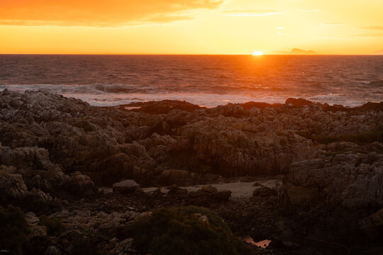sunset light over DeKelders coastline, Gansbaai, South Africa