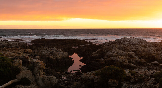 sunset light over DeKelders coastline, Gansbaai, South Africa